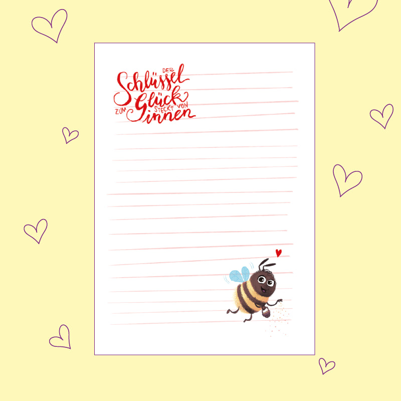 Briefpapier zum kostenlosen Download: oben links "Der Schlüssel zum Glück steckt von innen", unten rechts eine Biene mit Herz