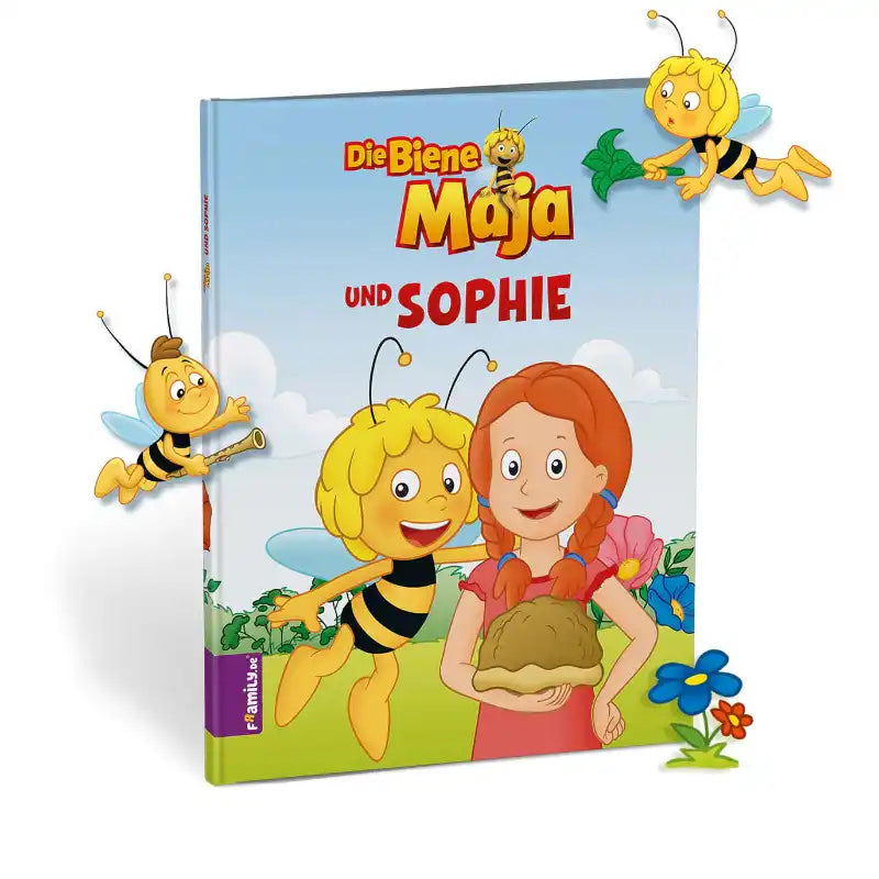 Umschlag des Framily personalisiertes Kinderbuches "Biene Maja und du", das Biene Maja und ein Kind zeigt, die zusammen zwischen Bienen und Blumen auf einer hellen Klatschmohnwiese lächeln.
